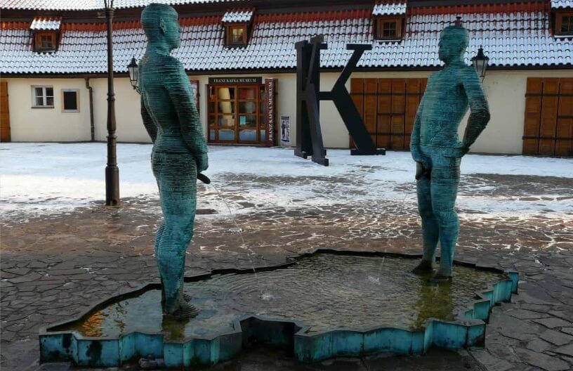 weird statue of two urinating guys
